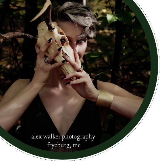 Dani Weeks holding a skull partially obscuring her face; photograph by Alex  Walker Photography, Fyreburg ME