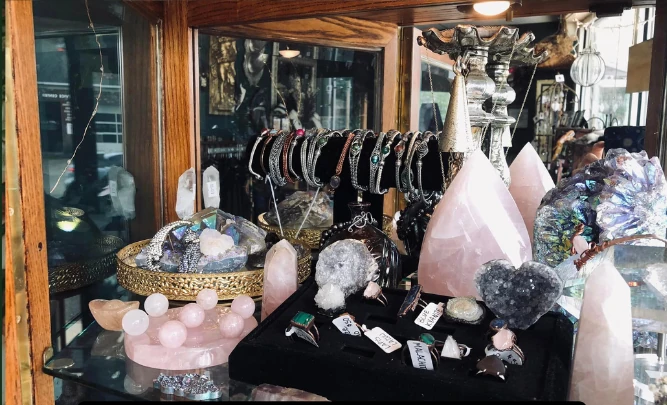 A display of Copper Electroformed Jewelry, Wire wrapped bracelets, and an assortment of crystals